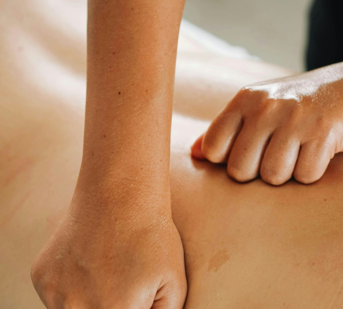 Massage therapist working on a client's back.